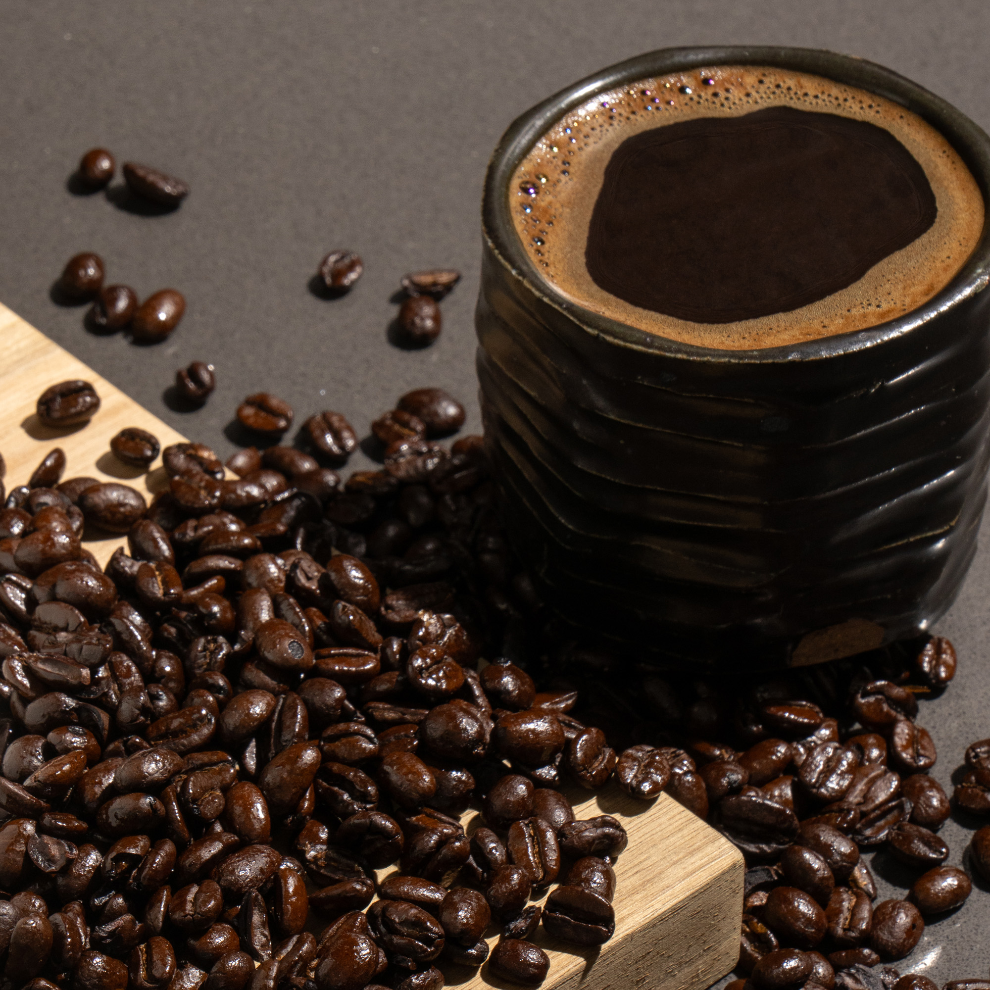 Bold dark roast coffee beans expertly roasted at Silent Café for rich, full-bodied flavor